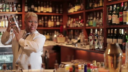 female cocktail waiter in classic cocktail bar