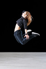Hip-hop dancer posing in dance studio
