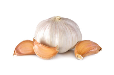 uncooked whole garlic with shell on white background