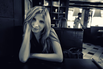 Beautiful young girl in cafe