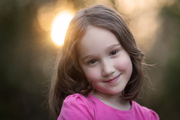 Beautiful Young Girl Smiling at Sunset