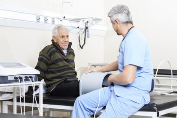 Senior Patient Receiving Electromagnetic Therapy