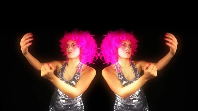 woman dances with pink crazy hairstyle