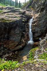 Waterfall on the river Kamenka in Khamar-Daban ridge