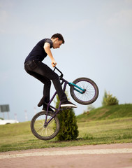 Fototapeta na wymiar teenager on a bicycle