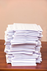 A stack of papers on desk
