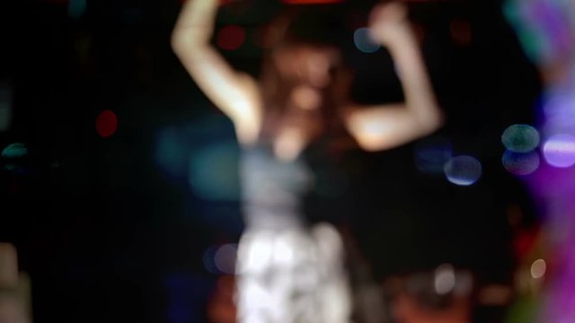 sexy woman dances in a disco
