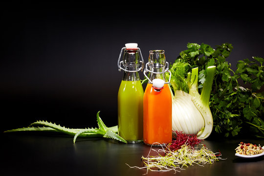 Glasses with fresh vegetable juices isolated on black. Detox die