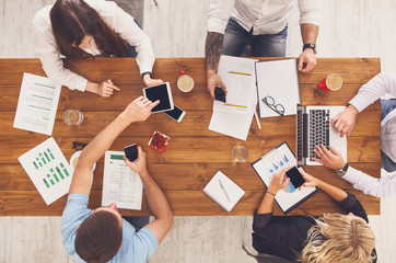 Group of busy business people working in office, top view