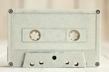 Obraz premium a tape cassette on wooden background.Monochrome