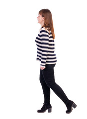 back view of walking  woman. beautiful blonde girl in motion.  backside view of person.  Rear view people collection. Isolated over white background. Girl in a striped sweater goes left.