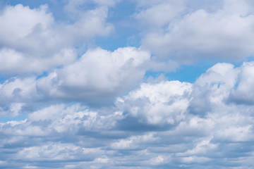Naklejka na ściany i meble Beautiful cloudscape over horizon. Blue sky and clouds. Natural cloudscape background. 