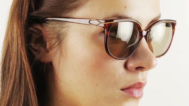 pretty woman wearing different retro sunglasses