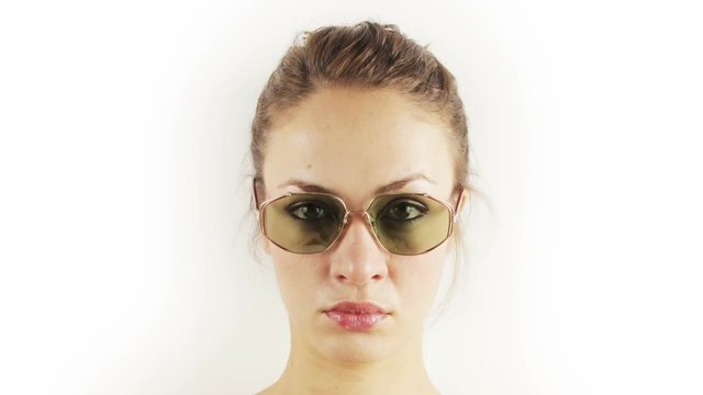 pretty woman wearing different retro sunglasses