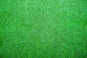 Artificial lawn grass green bright texture background
