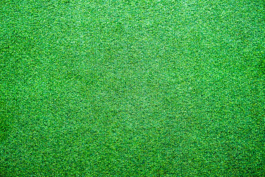 Artificial lawn grass green bright texture background