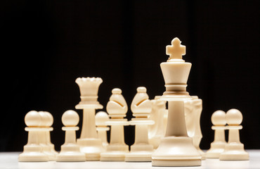 chess pieces on a black background