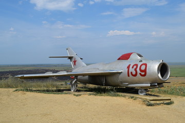 Fototapeta na wymiar Museum copy of the aircraft. Monument of fighter aircraft.