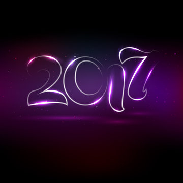 Glowing lettering 2017 on violet background