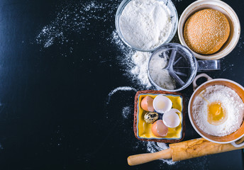 Ingredients and utensil for baking on the black board, top view