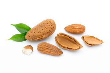 Almonds with leaves isolated on white background