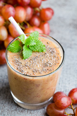 Grape smoothie, on the grey  background.