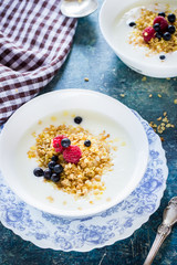 Two bowls with flakes and yoghurt.