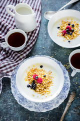 Healthy breakfast :oatmeal flakes with berries and tea/coffee.