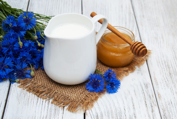 Jar of milk and cornflowers