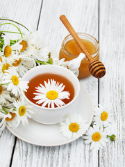 cup of herbal tea with chamomile flowers