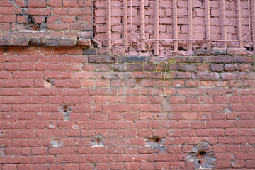 Brick wall with bullet marks