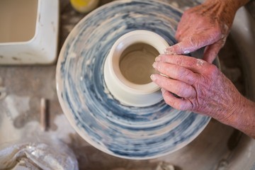 Fototapeta na wymiar Close-up of potter making pot