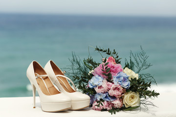 Gorgeous bouquet stands before the classy wedding shoes