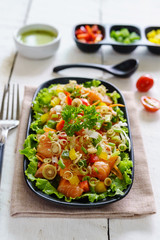 Fresh healthy thai spicy salmon salad mixed vegetable and herb