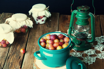 Fototapeta na wymiar Preparation of plums with sugar in jars for winter