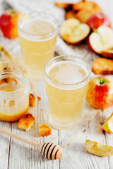 
summer and autumn cooling drink , white brew or kvass with honey , apples , raisins and bread on...