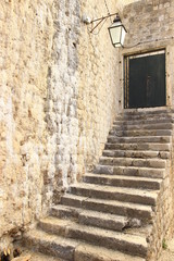 Fototapeta na wymiar Old stairs and street lantern in Dubrovnik, Croatia
