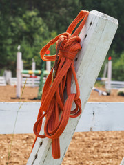 Lead Rope on a background of horse jumping field