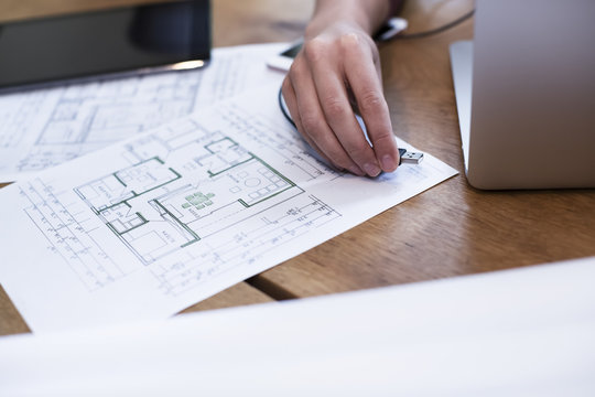 Close-up of woman connecting usb stick to laptop