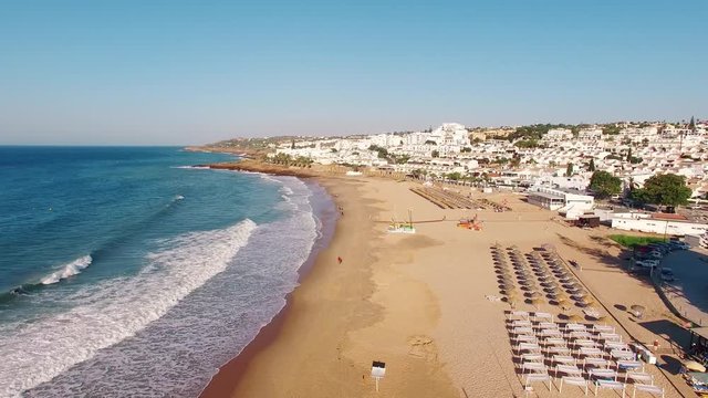 Beach of Praia da Luz at morning, Lagos, Algarve, Portugal aerial view