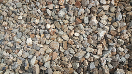 Crushed grey stone on the ground texture background