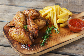 fried chicken wings french fries and sauce