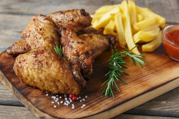 fried chicken wings french fries and sauce