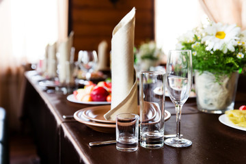 Wedding table in restaurant decorated with  flower composition