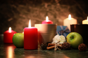 night cup of tea with candle and apple