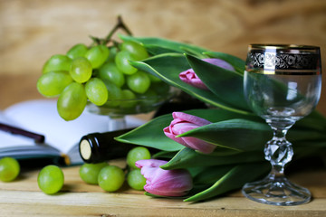 wine bottle book and glass grape