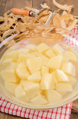 peeled and diced potatoes in a glass bowl