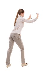back view of woman pushes wall. Isolated over white background. Rear view people collection....