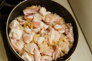 the chicken pieces in the pan