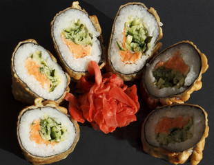 Sushi over black background